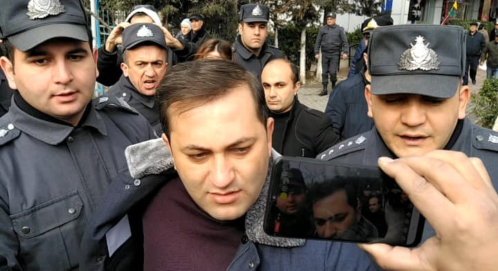 Ruslan Izzetli being detained during a protest on 11 February against February’s elections results. Photo Fatima Movlamli.