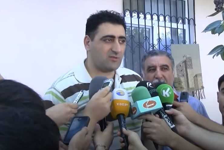 Azerbaijani press interviews Ramil Safarov. Screengrab of video by RFE/RL.