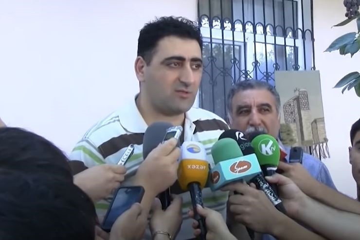 Azerbaijani press interviews Ramil Safarov. Screengrab of video by RFE/RL.