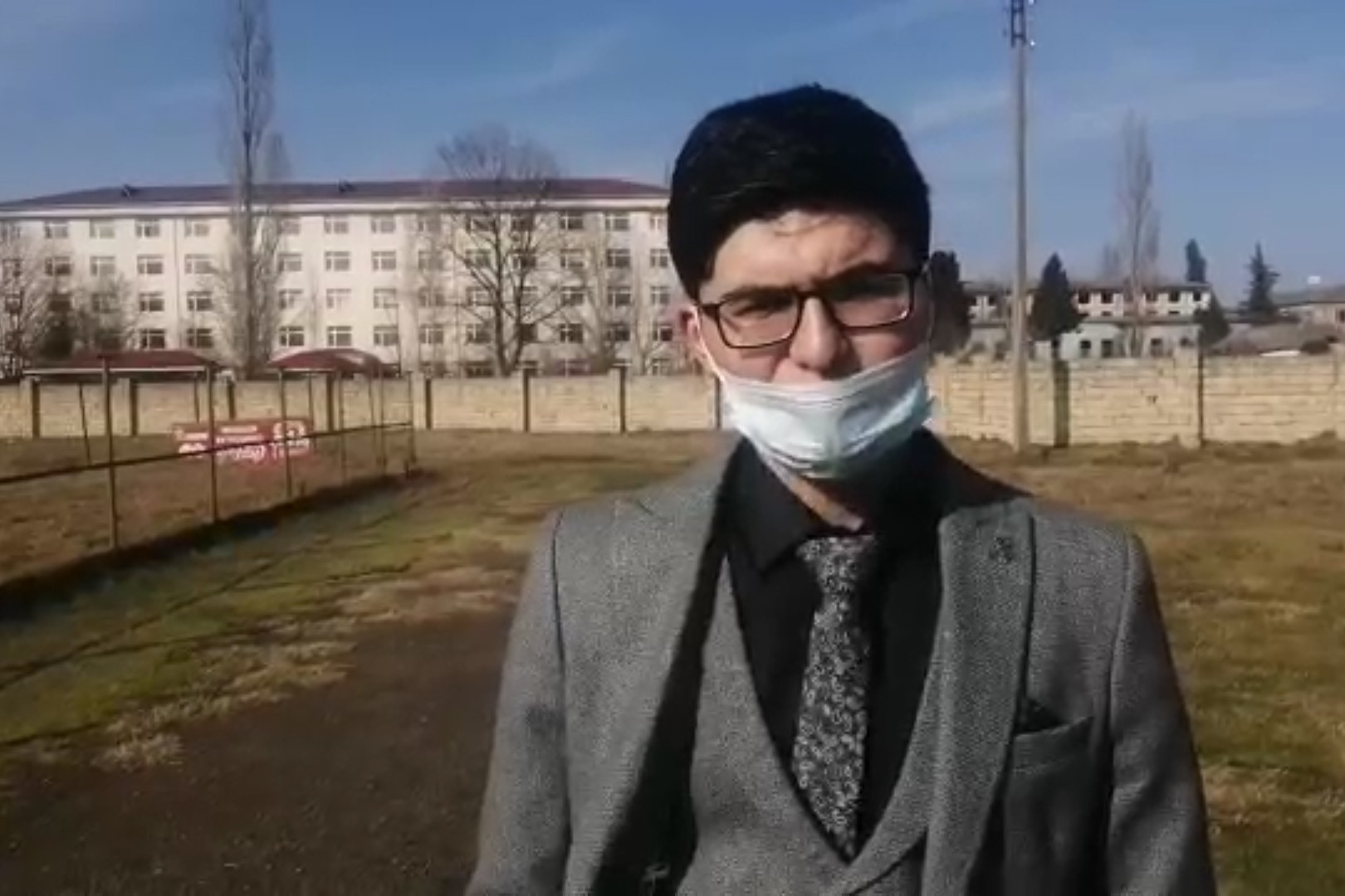 Ahmad Mammadli, a student activists from the Student Power Centre, reads statement of protest aloud outside the Lankaran State University.