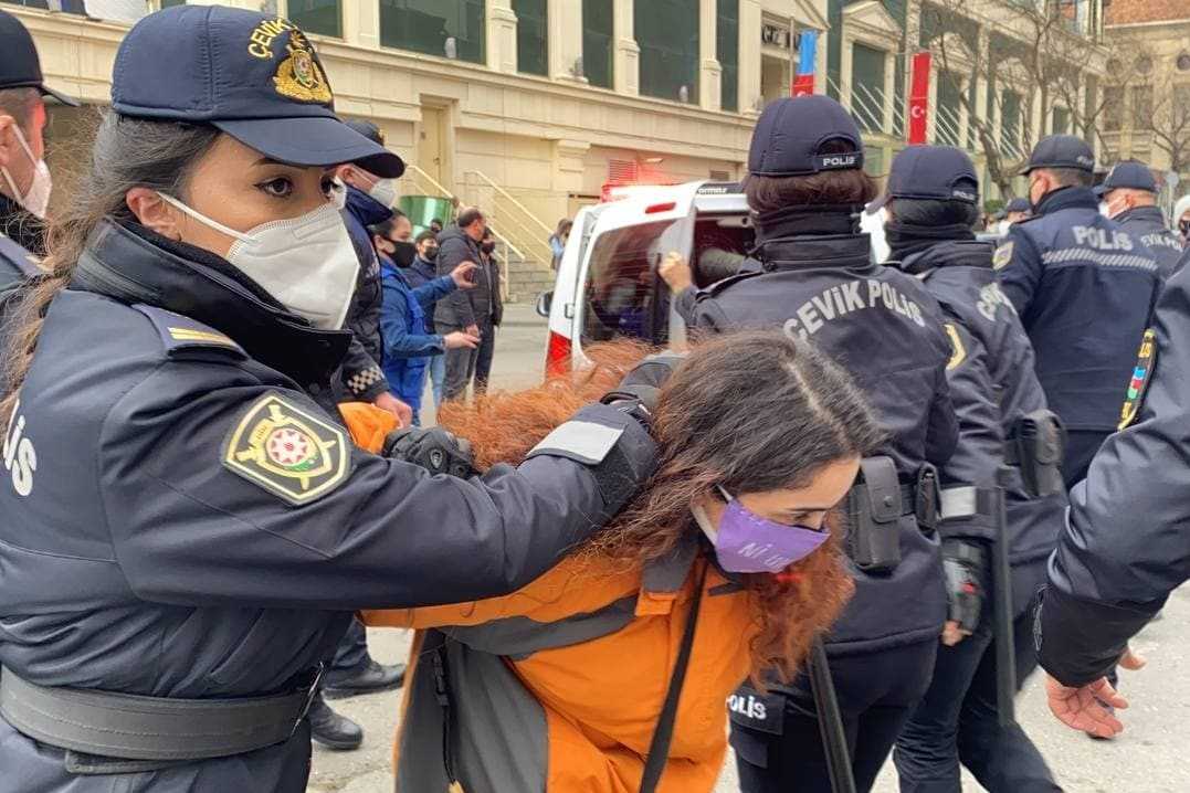 A woman is detained at a demonstration in Baku on International Women’s Day 2021. Photo: Ulviyya Ali/OC Media.
