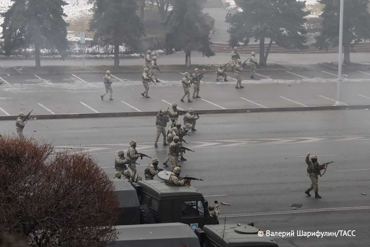 Kazakh security forces opening fire on protesters in central Almaty. Photo: Valery Sharifulin/TASS.