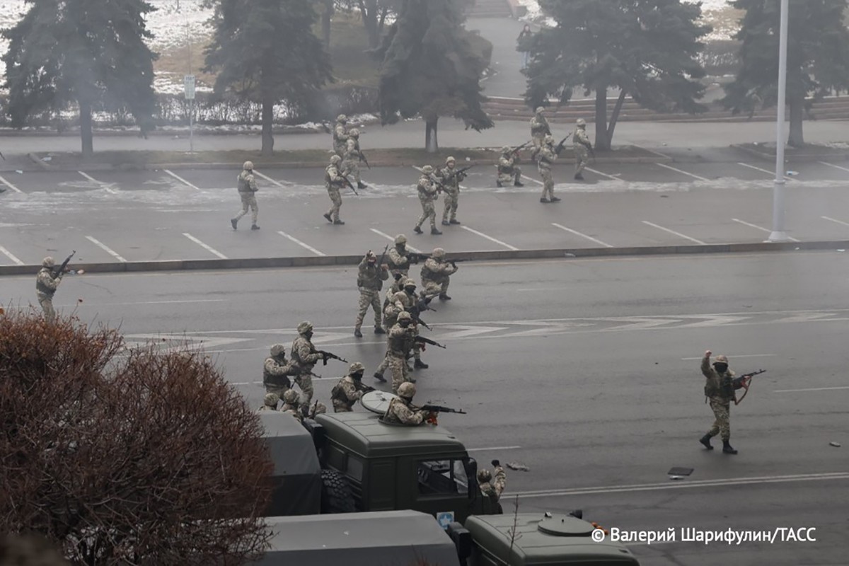 Kazakh security forces opening fire on protesters in central Almaty. Photo: Valery Sharifulin/TASS.
