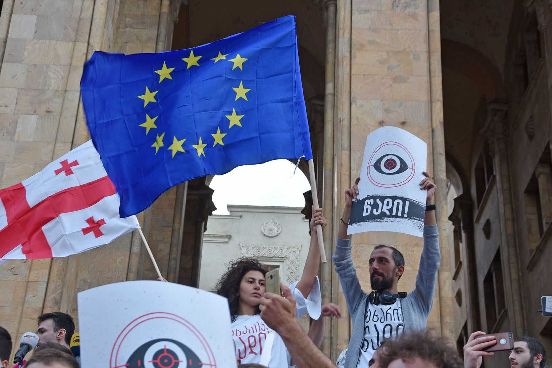 Anti-government protesters outside the Georgian Parliament in June 2019 hold the EU and Georgian flags. Photo: Mariam Nikuradze/OC Media.