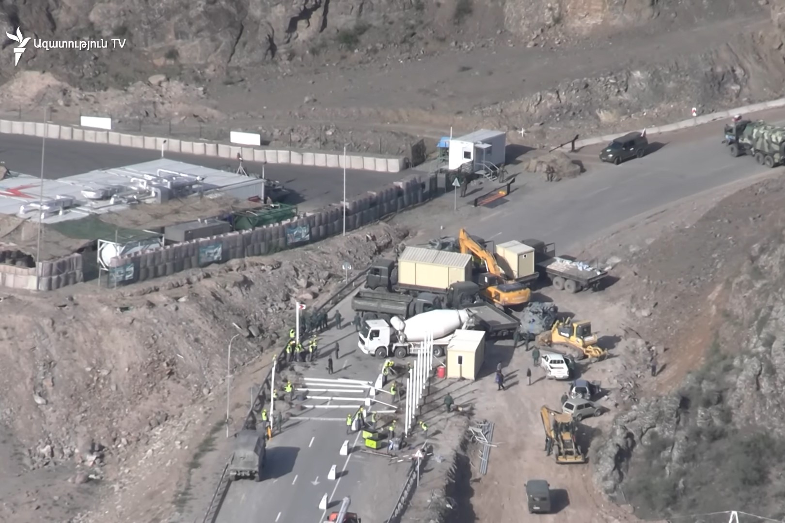 Footage from RFE/RL showed Russian peacekeepers looking on as construction of the Azerbaijani checkpoint was underway.