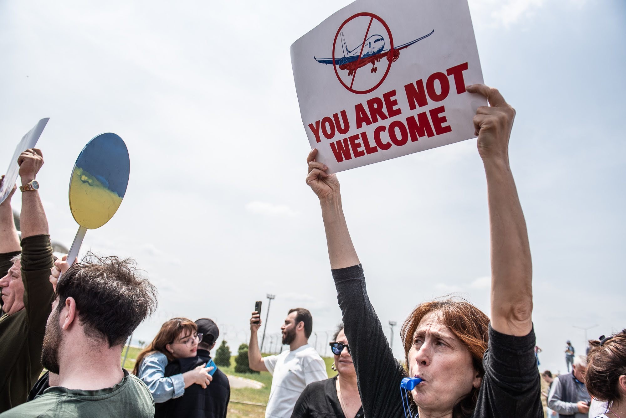 Georgian activist protesting the first Russian-Georgian flight arrival in Tbilisi on 19 May. Image: Mariam Nikuradze/OC Media.