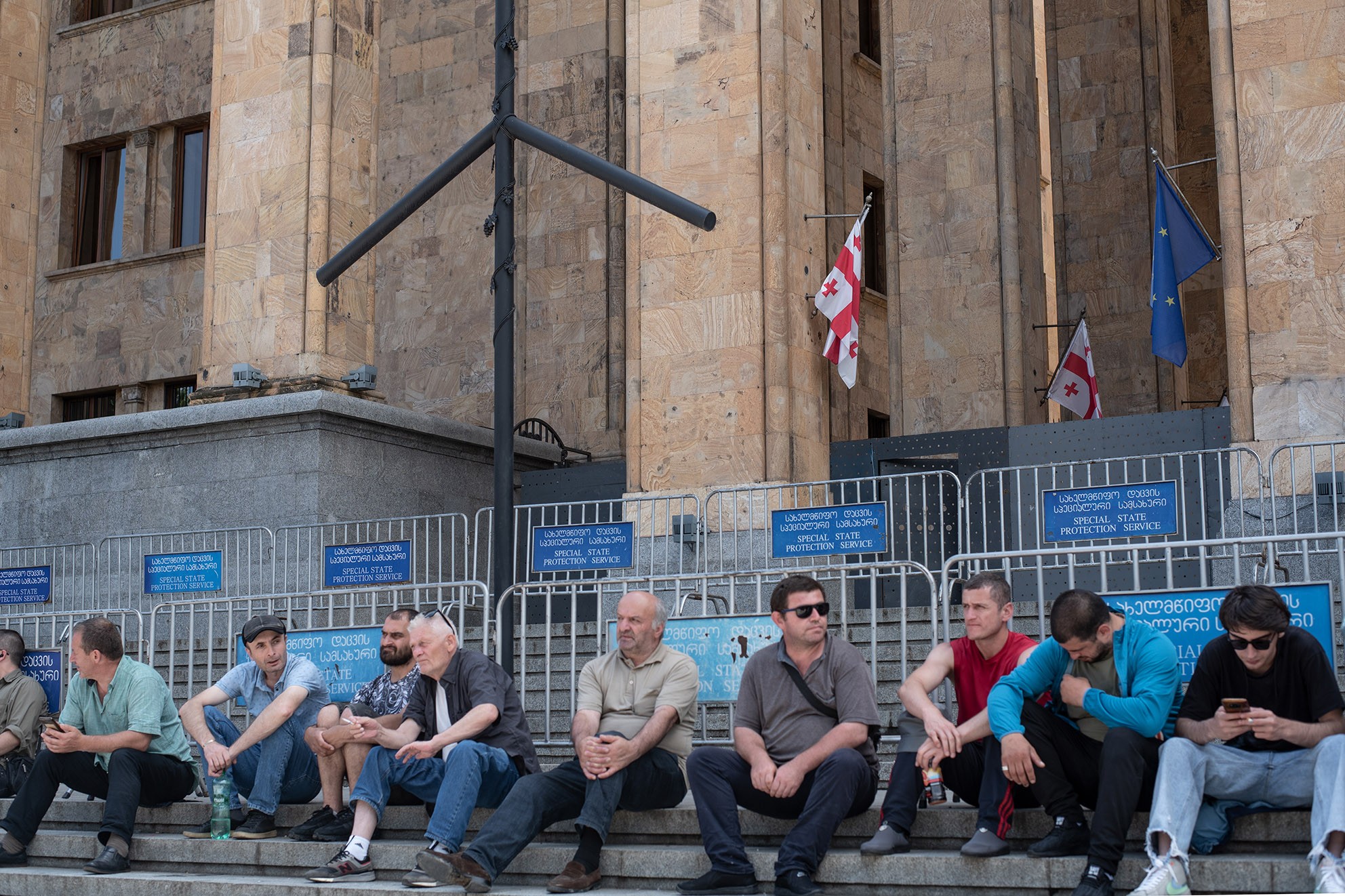 A group of striking miners from Chiatura outside the parliament building in Tbilisi. Photo: Mariam Nikuradze/OC Media.