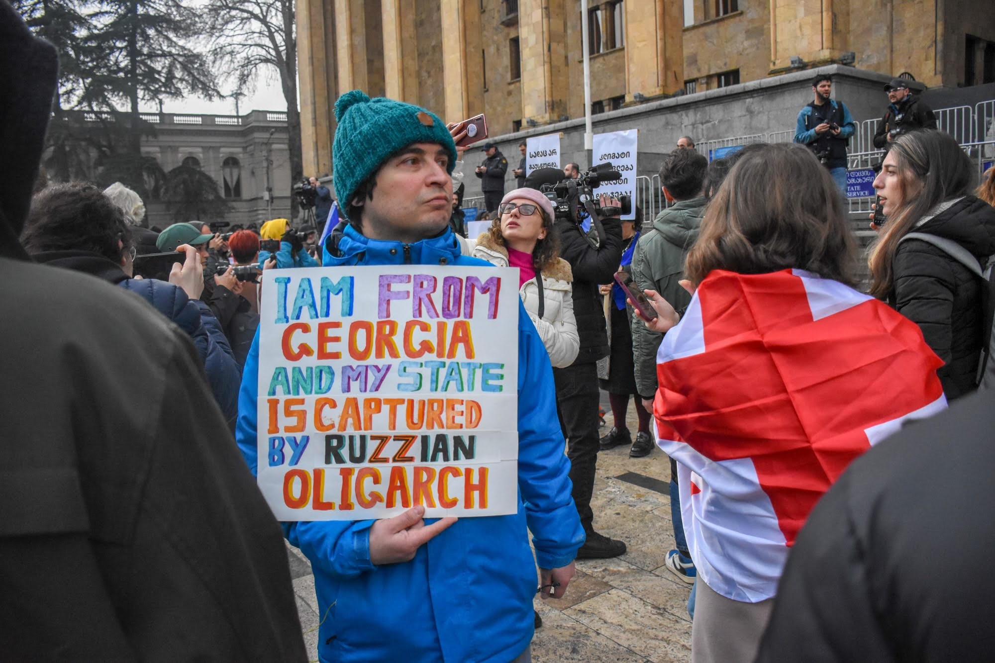 A protester holds a sign referencing Bidzina Ivanishvili at a demonstration against the government’s draft foreign agent laws in March. Photo: Tata Shoshiashvili/OC Media.