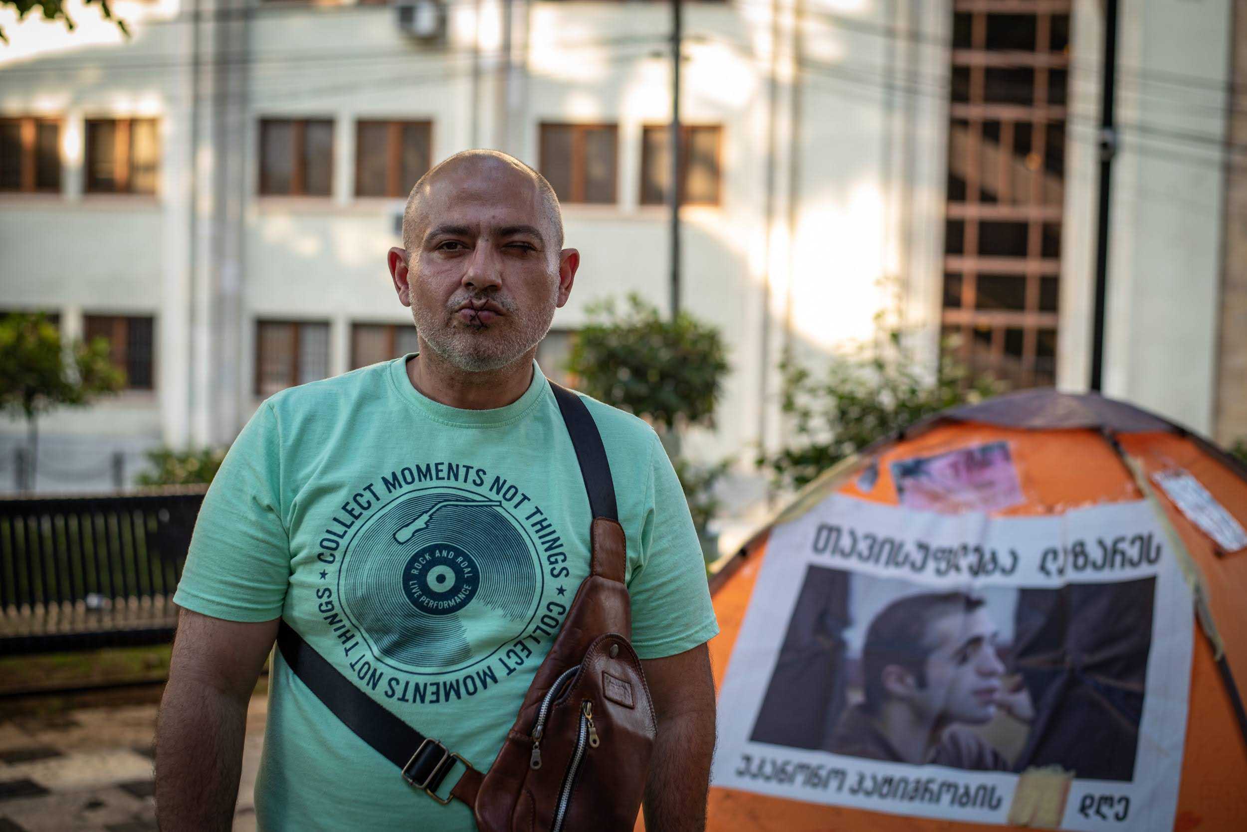 Beka Grigoriadis protesting outside the parliament in Georgia in July 2023. Photo: Mariam Nikuradze/OC Media.