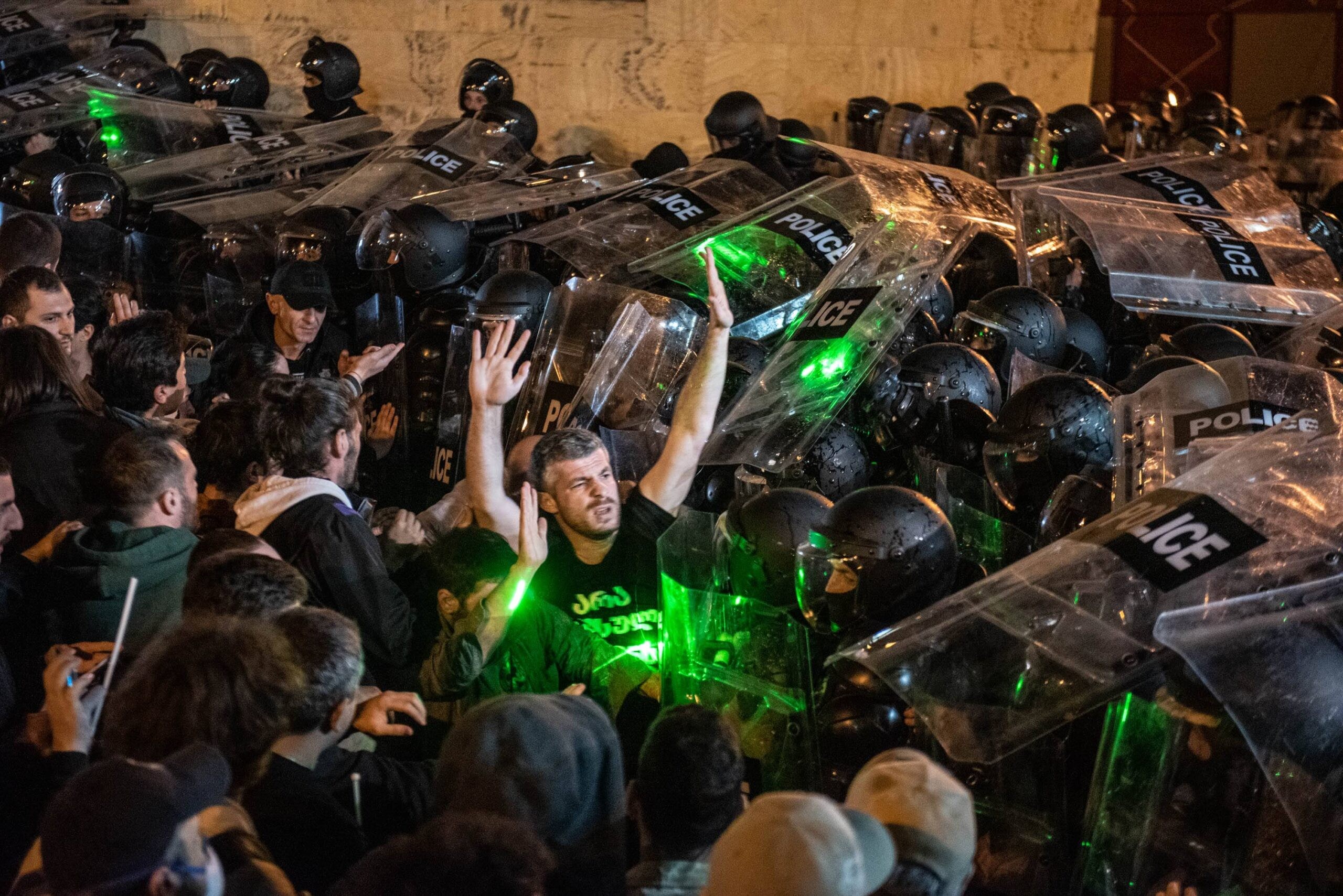 Riot police attempting to physically disperse protesters behind parliament. Photo: Mariam Nikuradze/OC Media