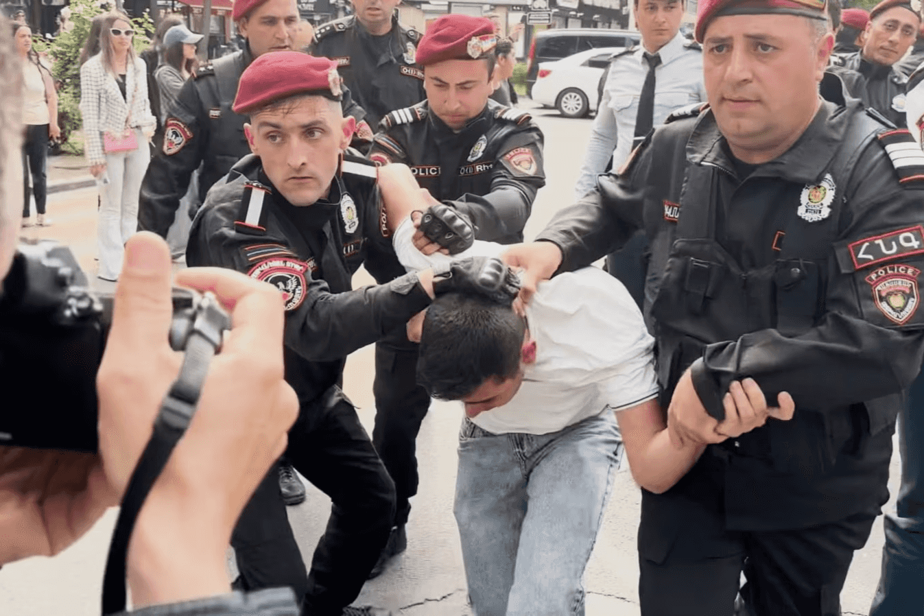 Police detaining a protester against the delimitation process in Yerevan. Image via RFE/RL.