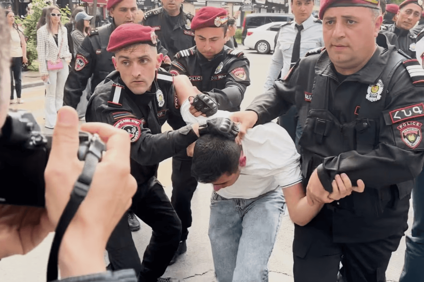 Police detaining a protester against the delimitation process in Yerevan. Image via RFE/RL.