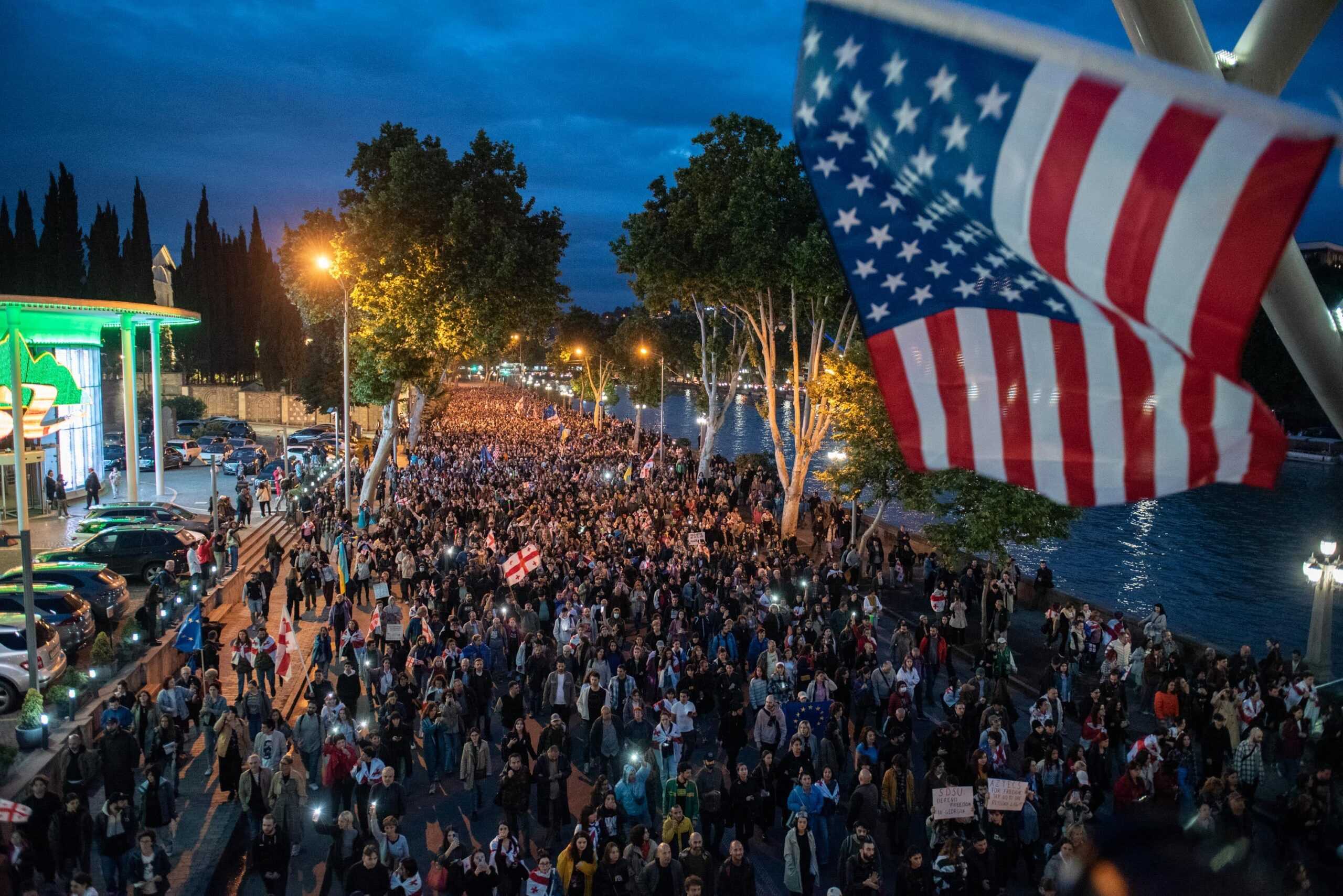 Protesters against the foreign agent law march along Tbilisi’s riverbank on 24 May. Photo: Mariam Nikuradze/OC Media.