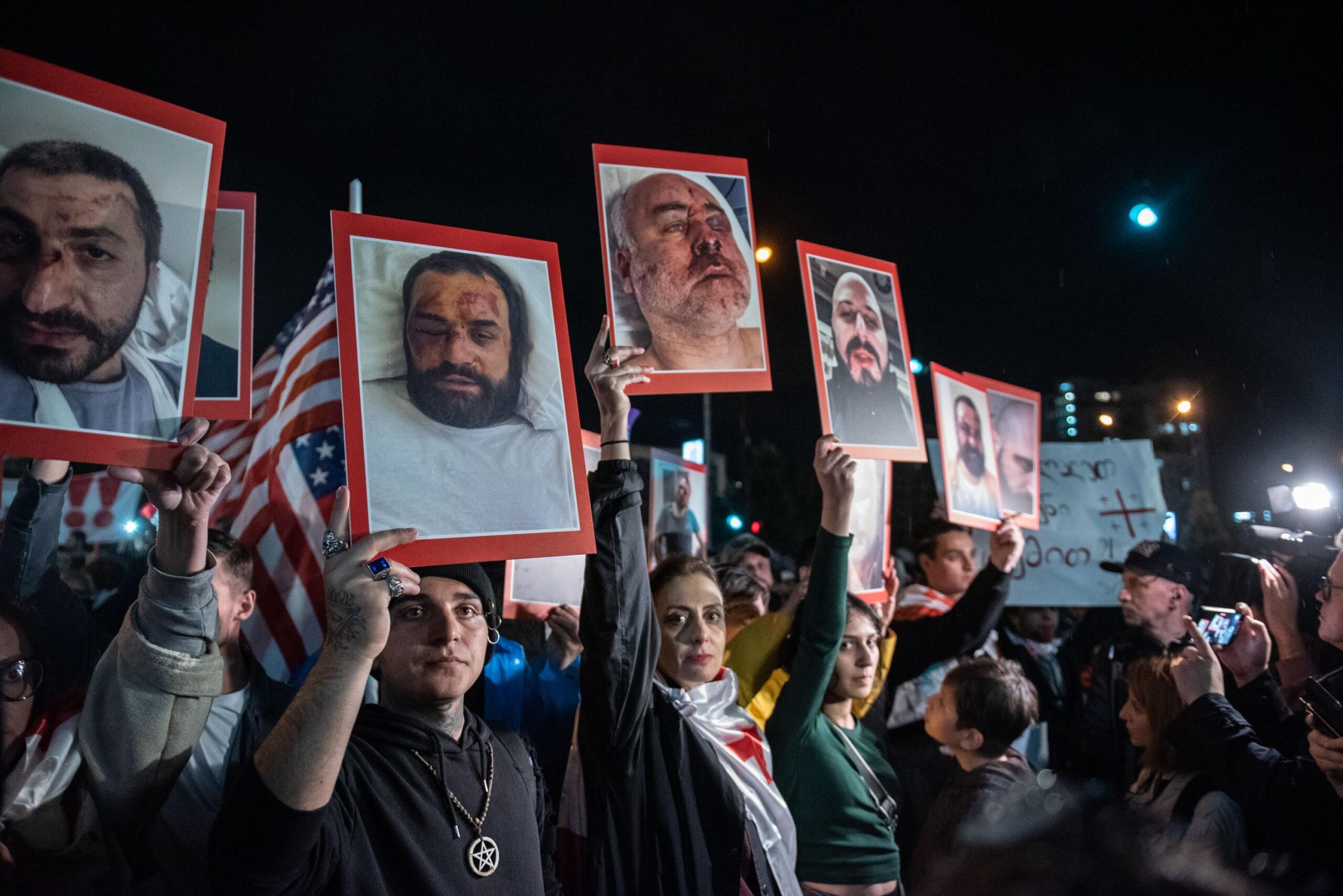 On 24 May, protesters marched to the offices of the Interior Ministry in Tbilisi carrying images of victims of ambush attacks and police brutality. Image: Mariam Nikuradze/OC Media.
