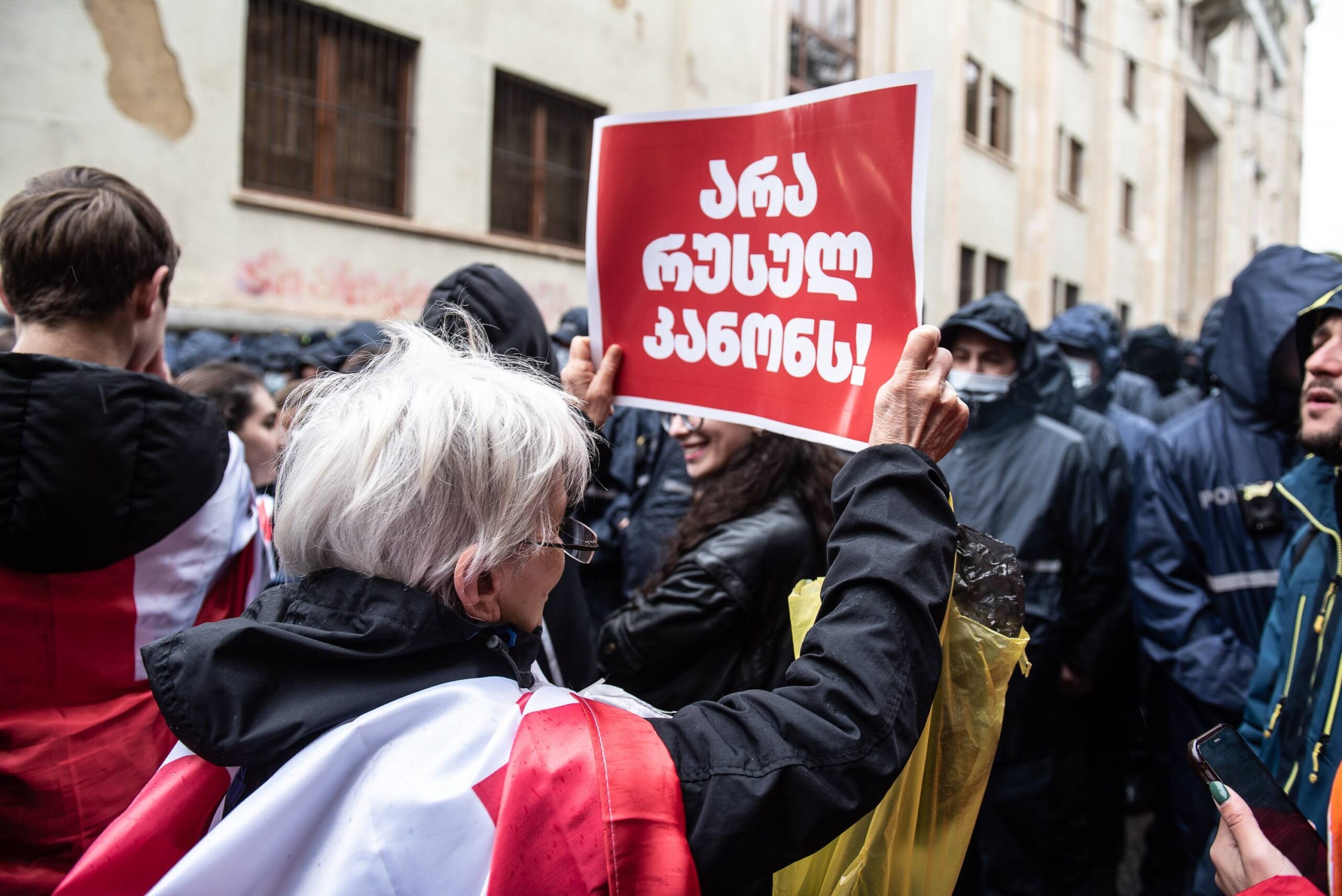 A protester holds a sign saying ‘No to the Russian law’ outside Georgia’s parliament on 14 May 2024. Photo: Mariam Nikuradze/OC Media.