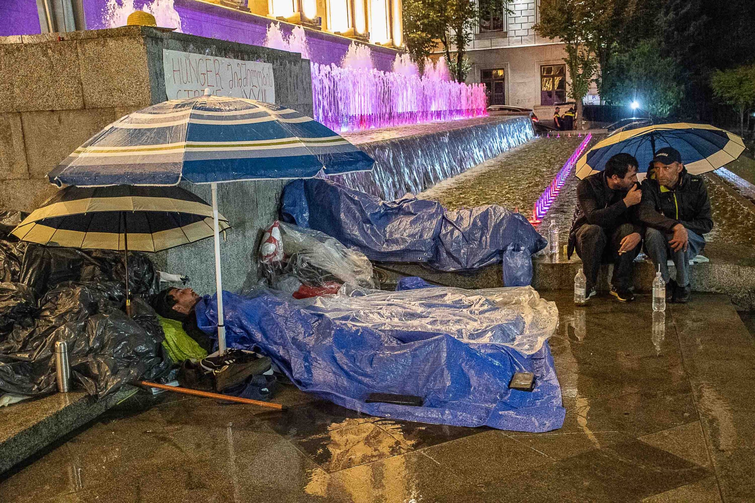 Shukruti protesters sleeping under rain outside the parliament. Photo: Mariam Nikuradze/OC Media.