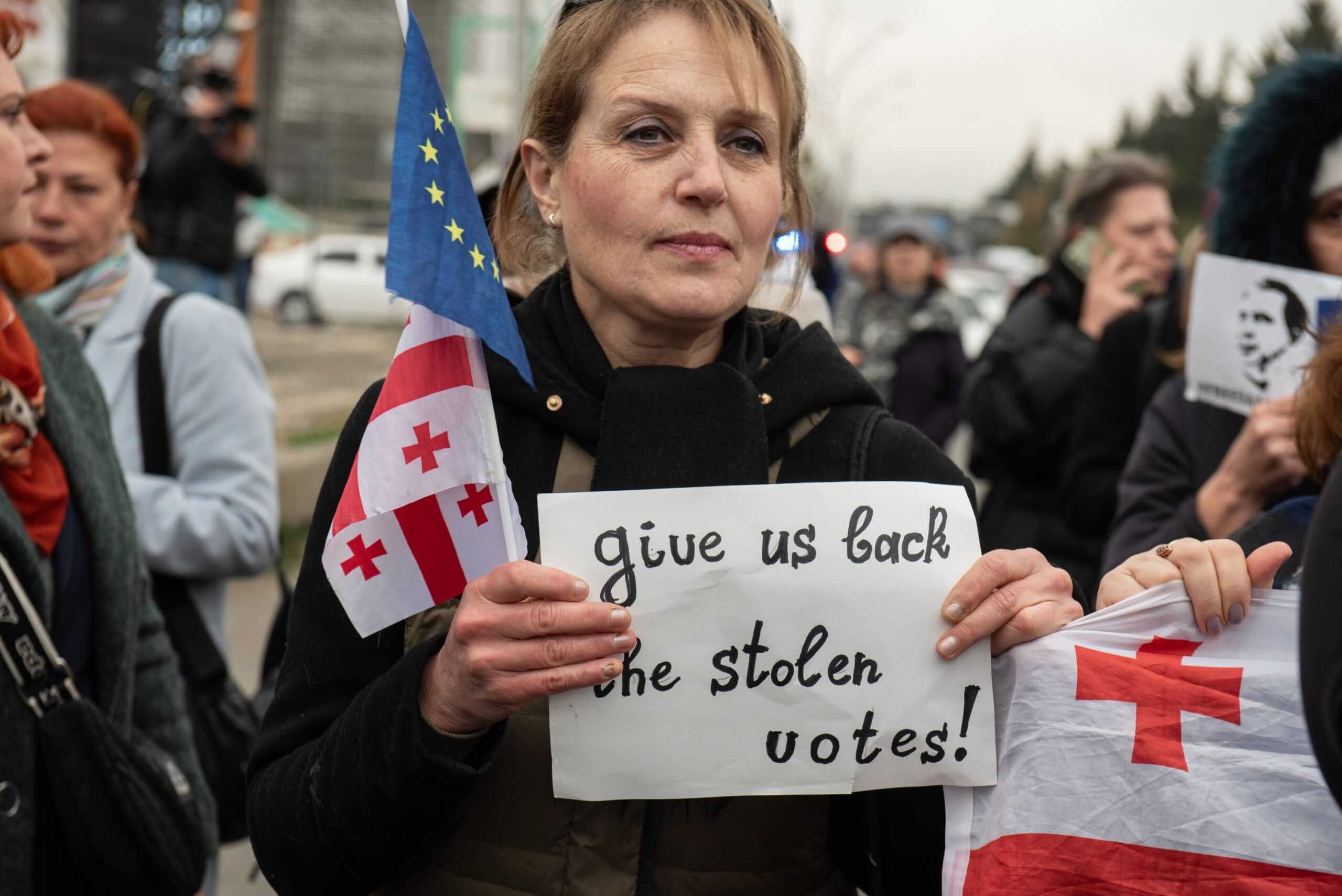 A women protests outside Central Election Commission on 13 November. Photo: Mariam Nikuradze/OC Media.