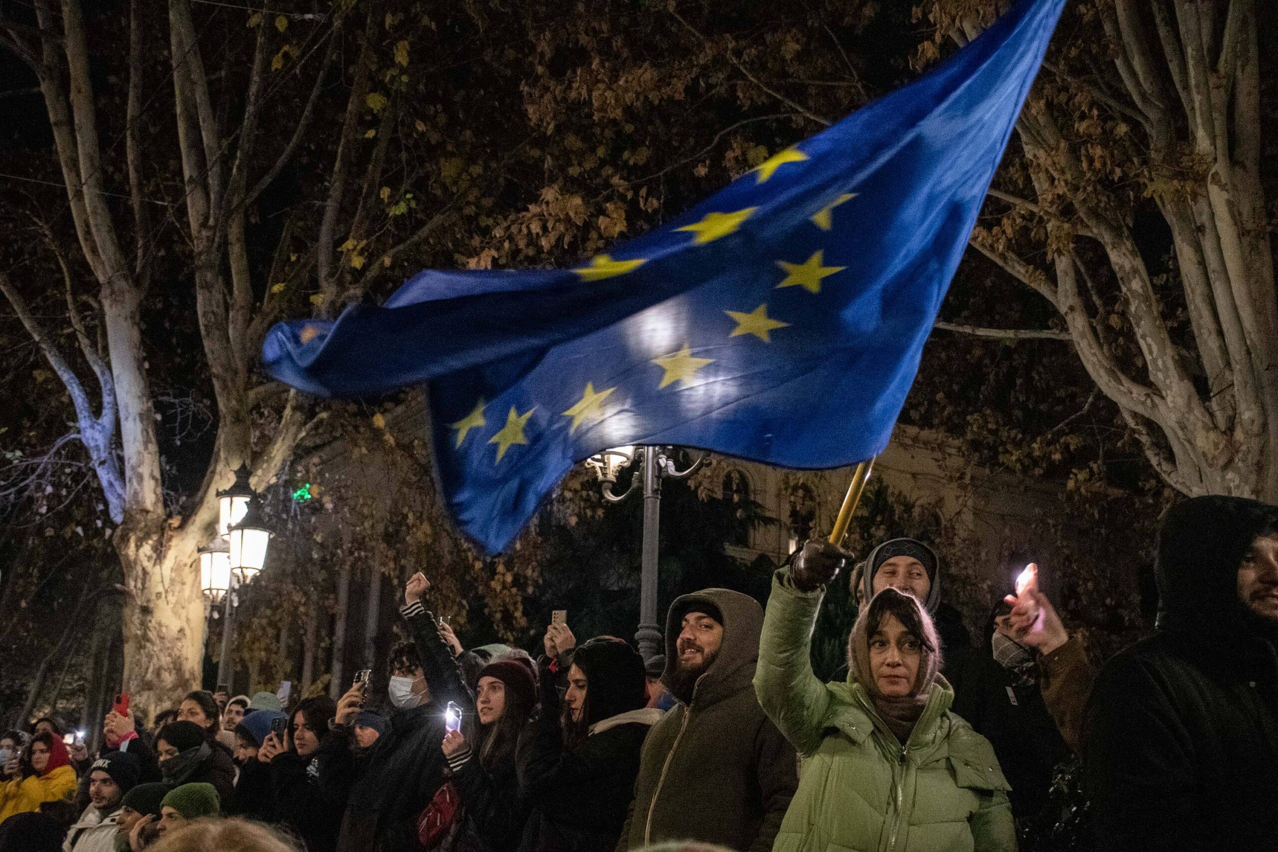 A woman waves the EU flag during a demonstration on Rustaveli Avenue. Photo: Mariam Nikuradze/OC Media.