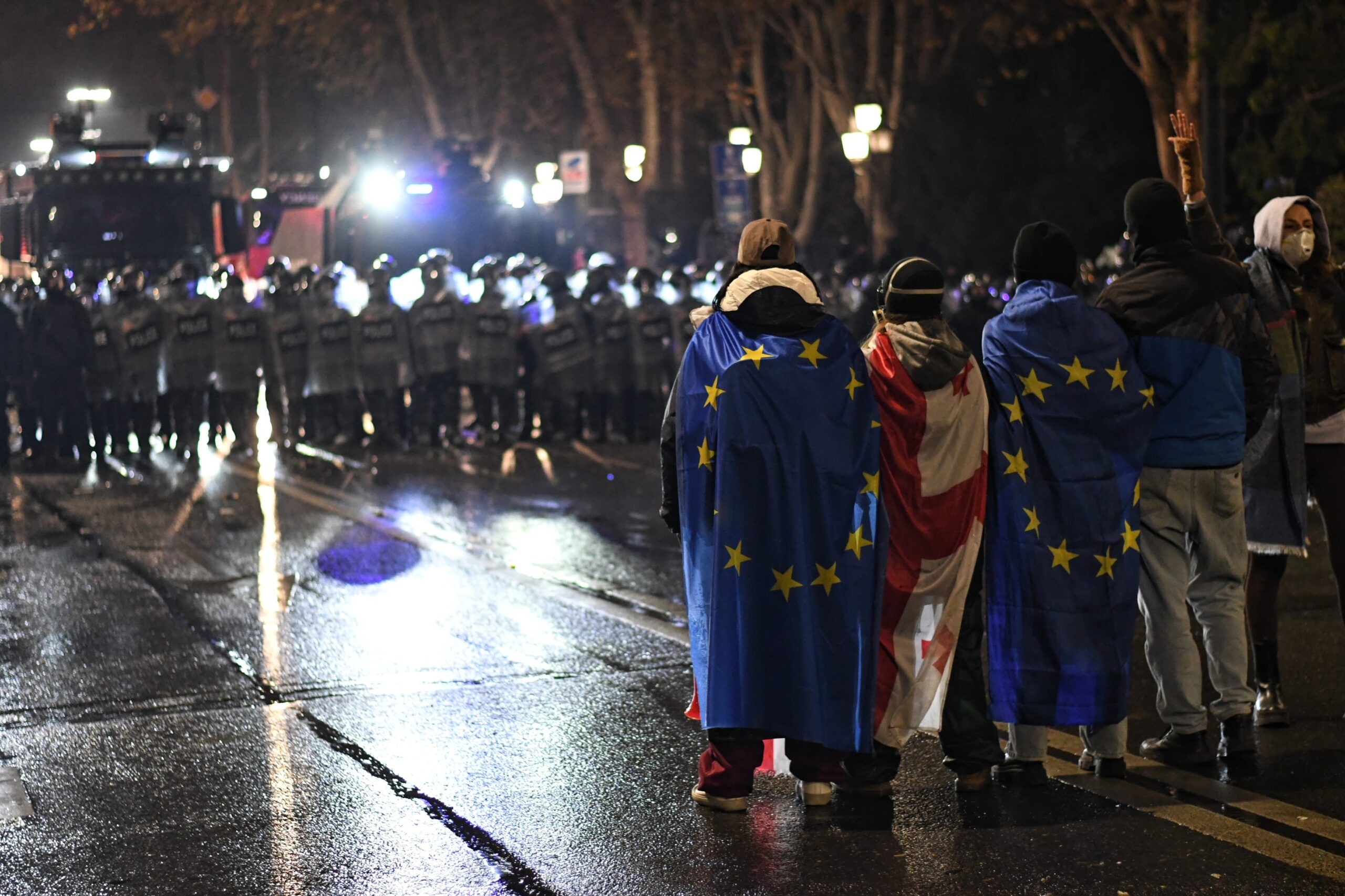 Protesters with EU and Georgian flags face riot police during last night's demonstration in Tbilisi. Mariam Nikuradze/OC Media.