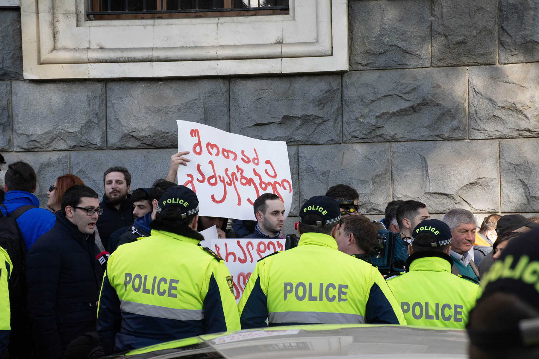 A protest sign reading ‘Shotadze the fraud’. Photo: Shota Kincha/OC Media.