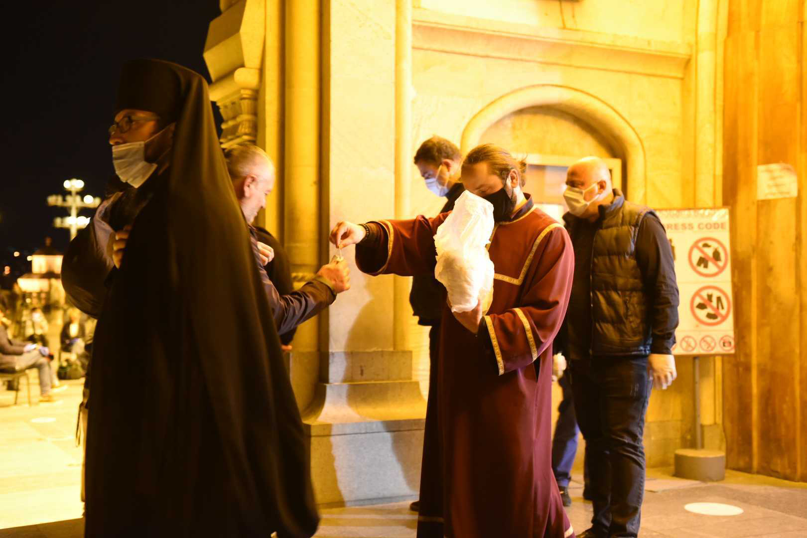 Clergy handed out facemasks to people entering the Church. Photo: Mariam Nikuradze/OC Media.