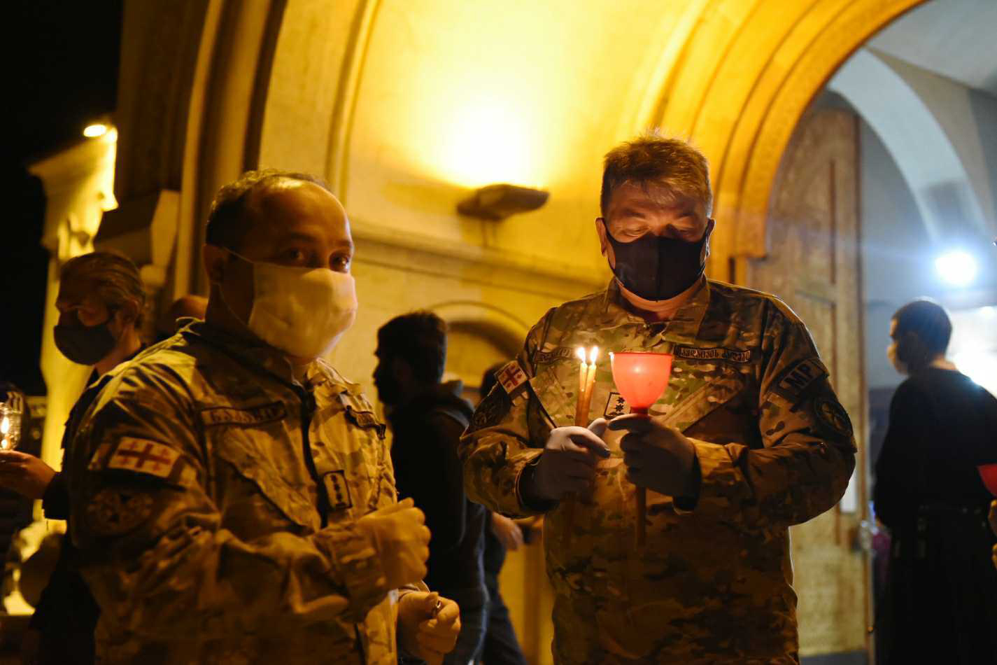 Soldiers lighting candles at Sameba Trinity Cathedral. Photo: Mariam Nikuradze/OC Media.