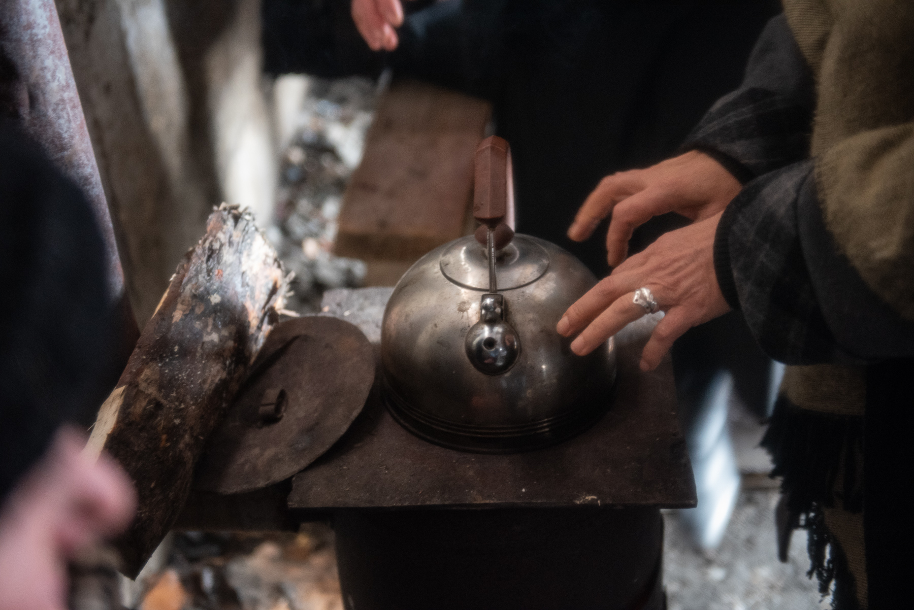 Protesters warming up at a wood burning stove in February 2020. Photo: Mariam Nikuradze/OC Media.