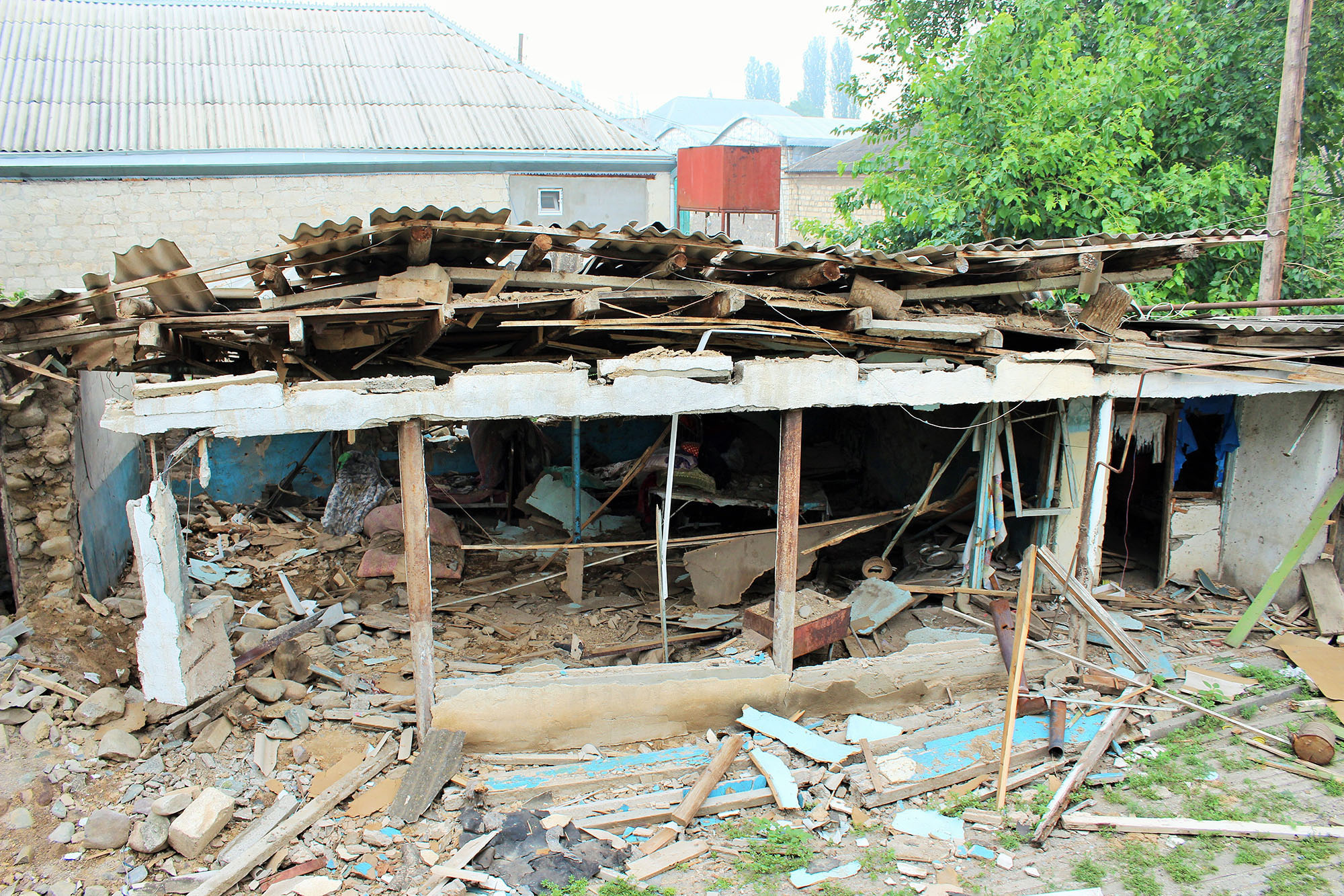 Ущерб, нанесённый дому Розы и Бираны Абдуллаевых. Фото: Сеймур Кязымов / OC Media